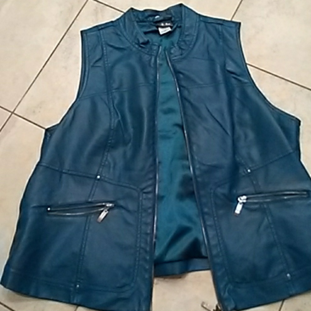 Leather teal vest zipper and. Zippered pockets